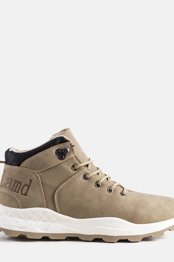 Grüne isolierte Vivian-Stiefel