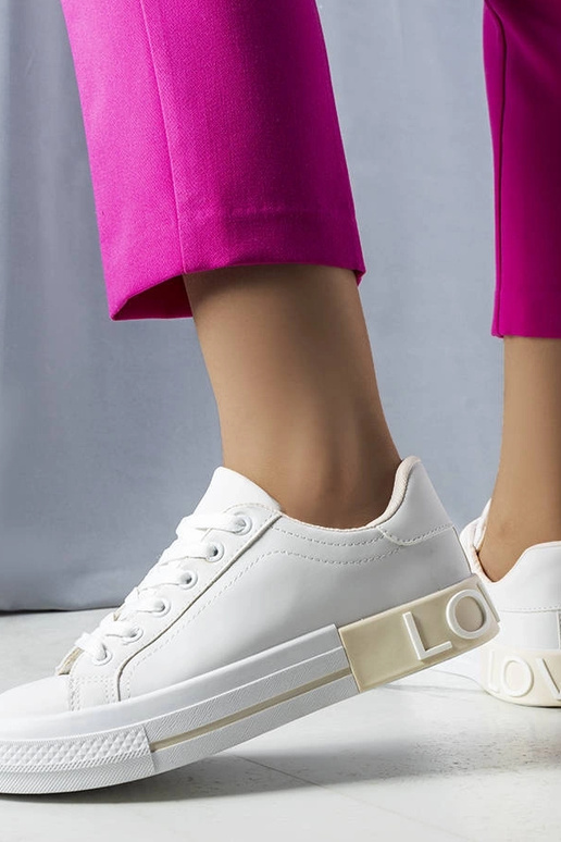 Weiße und beige Sneaker verziert mit...