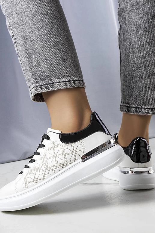 Schwarze und weiße perforierte...