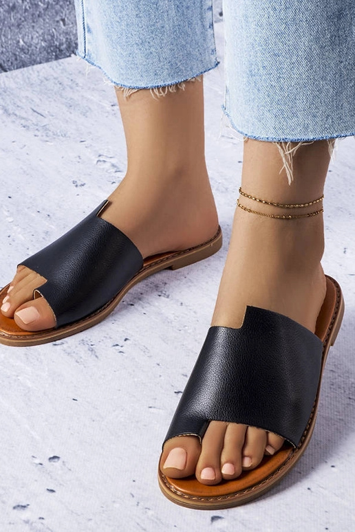 Schwarze Slipper mit unregelmäßigem...