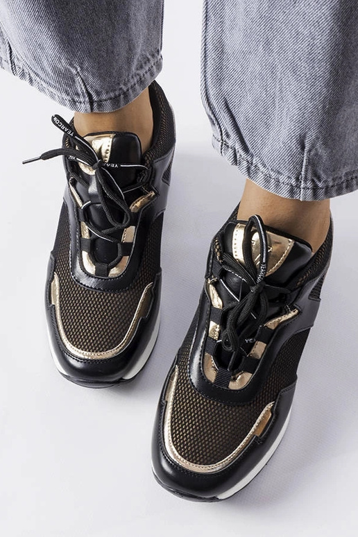 Schwarz-goldene Sportschuhe mit...