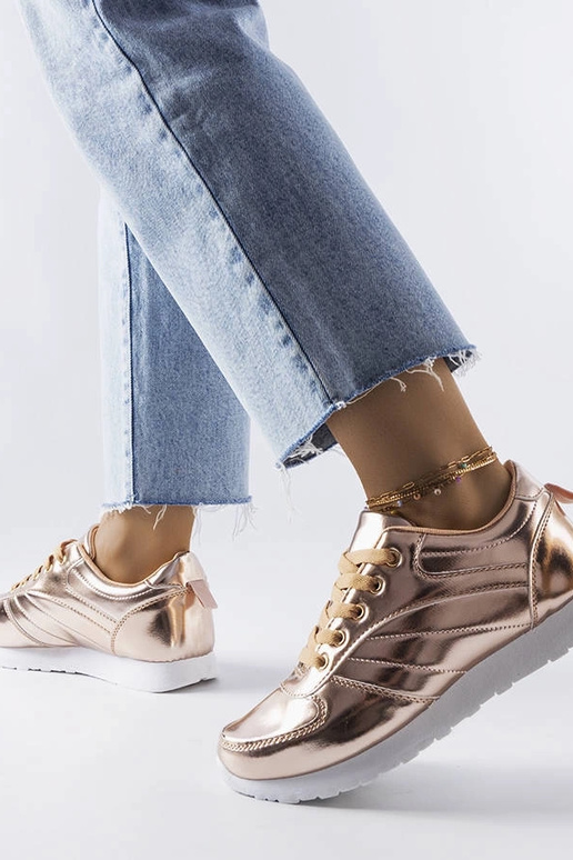 Goldene Turnschuhe von Quessy