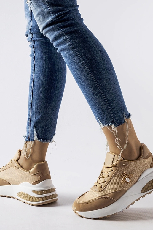 Braune und weiße Sneaker mit...