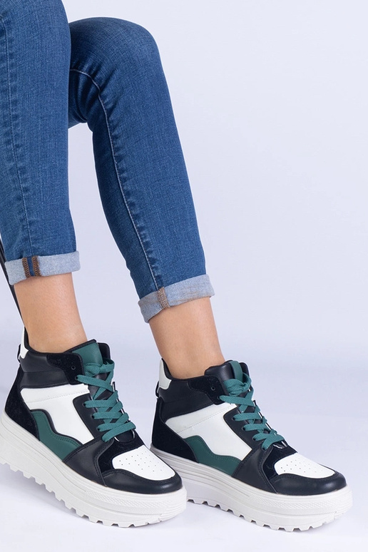 Schwarz-weiße Damen-Sportsneaker auf... Schwarz-weiße Damen-Sportsneaker auf...