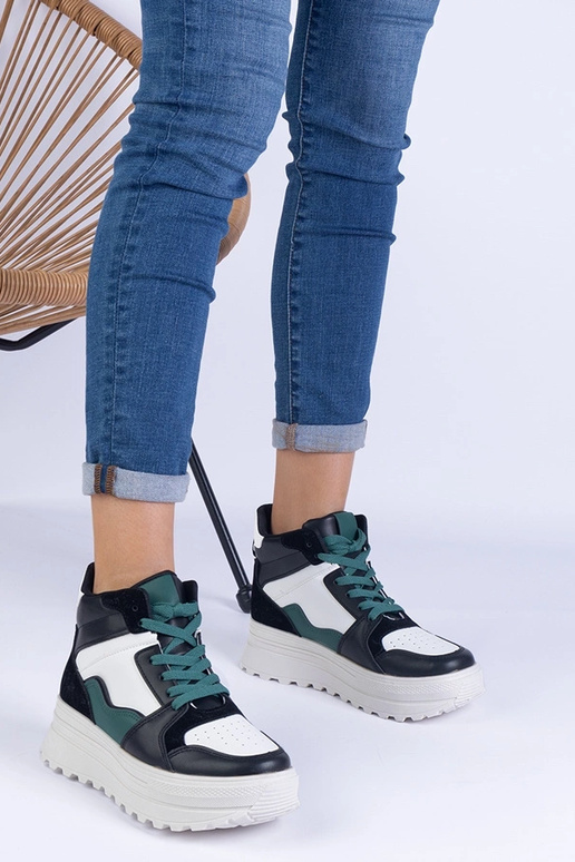 Schwarz-weiße Damen-Sportsneaker auf... Schwarz-weiße Damen-Sportsneaker auf...