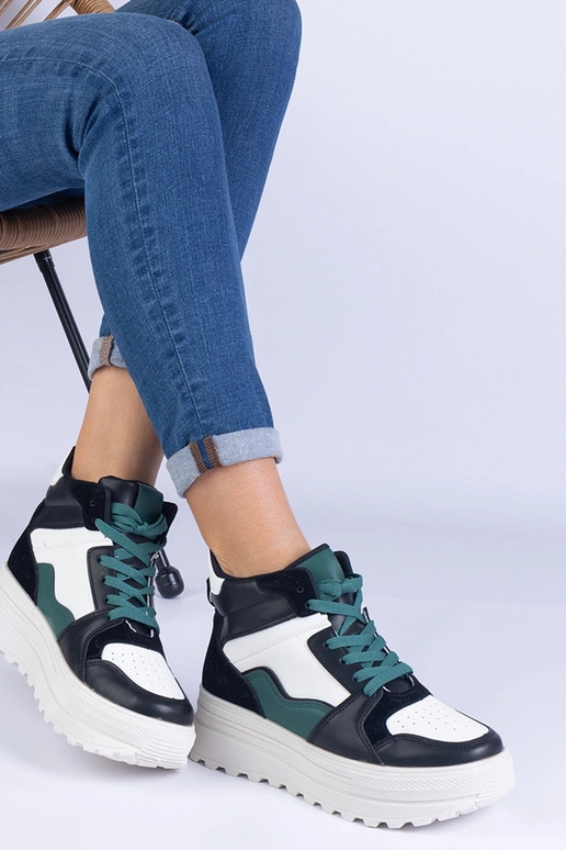 Schwarz-weiße Damen-Sportsneaker auf... Schwarz-weiße Damen-Sportsneaker auf...