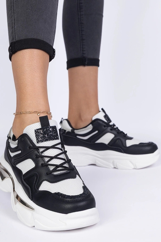 Schwarze sportliche Damen-Sneakers...