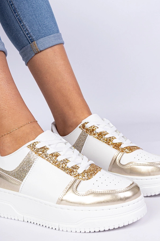 Goldene Damensneaker auf dicker Sohle...