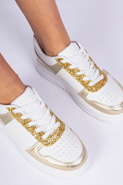 Goldene Damensneaker auf dicker Sohle...