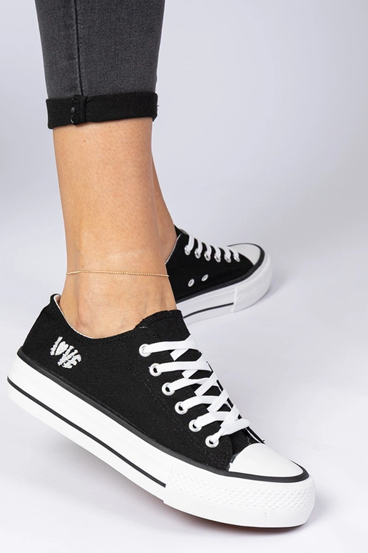 Schwarze klassische Damen-Sneakers...