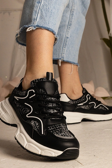 Schwarze Damen Sneakers...