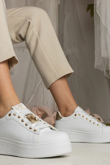 Weiß-goldene Damen Sneakers...