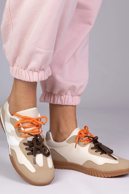 Sandfarbene Sportschuhe mit bunten...