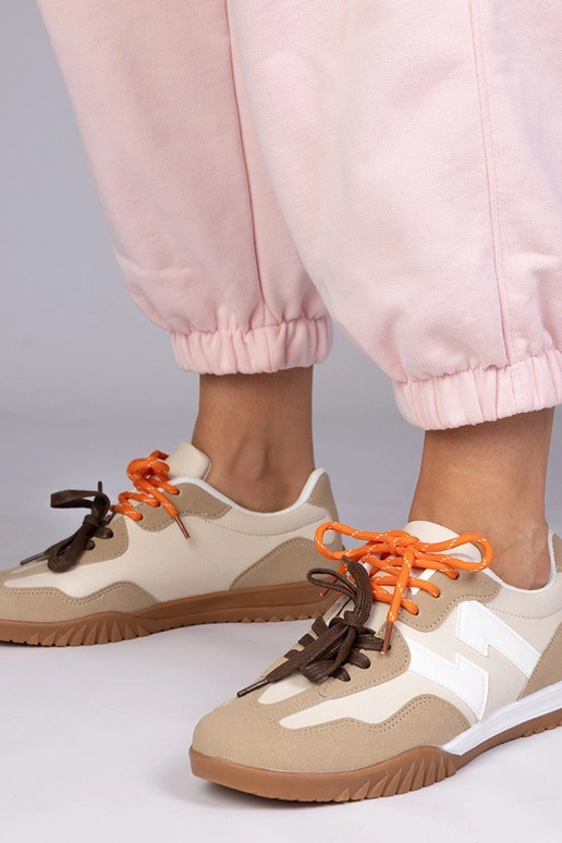 Sandfarbene Sportschuhe mit bunten...