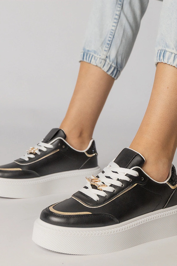 Schwarze Sportschuhe mit...