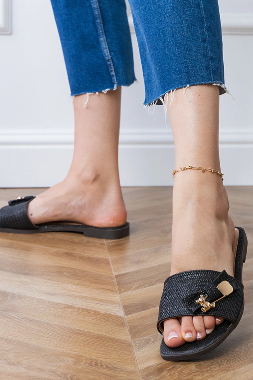 Schwarze flache Hausschuhe mit...