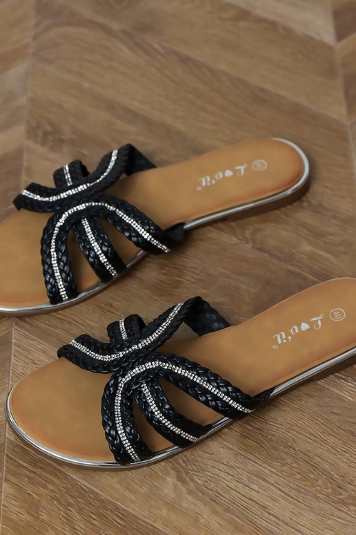 Schwarze flache Hausschuhe mit...