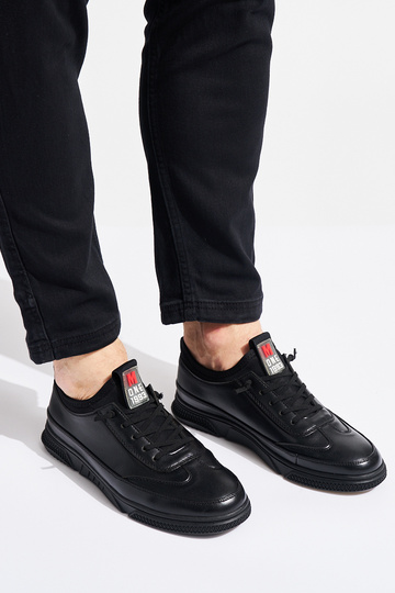 schwarze Sportschuhe für... 2