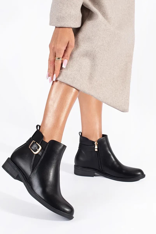 Schwarze Damenschuhe mit goldenen...