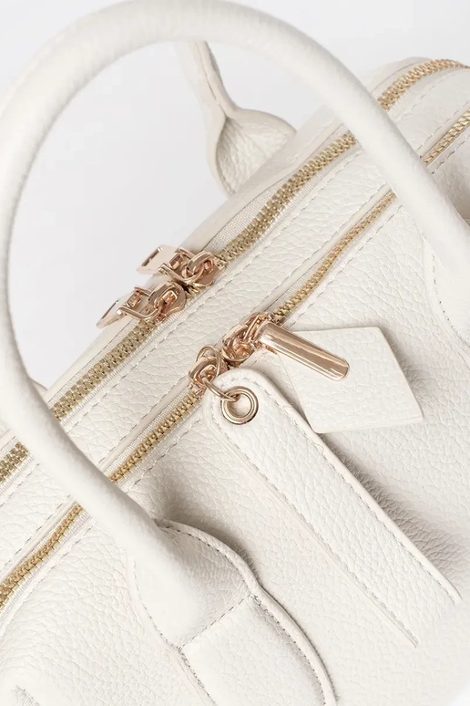 Helle sandfarbene Damenhandtasche Helle sandfarbene Damenhandtasche