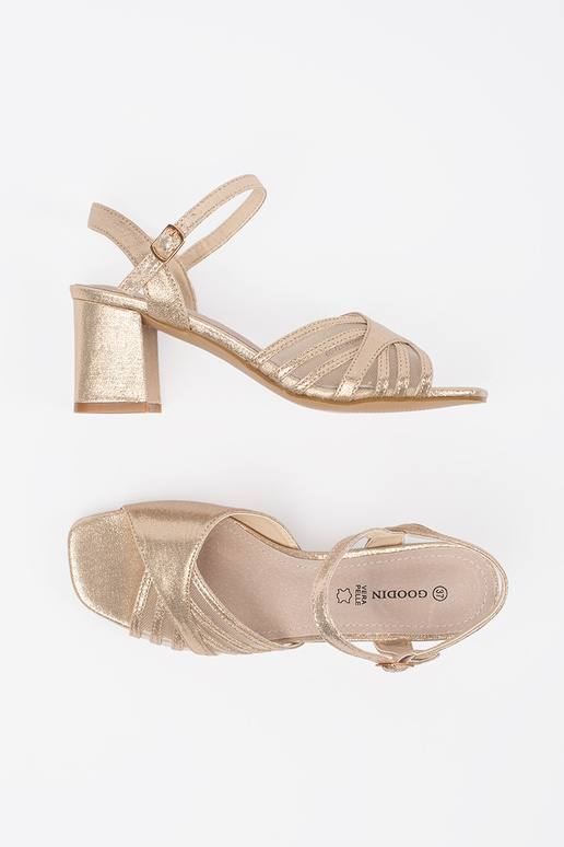 Goldfarbene glänzende Sandalen mit...