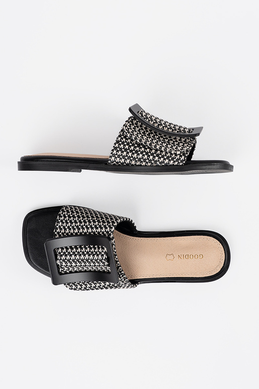 Schwarz-weiße flache Pantoletten