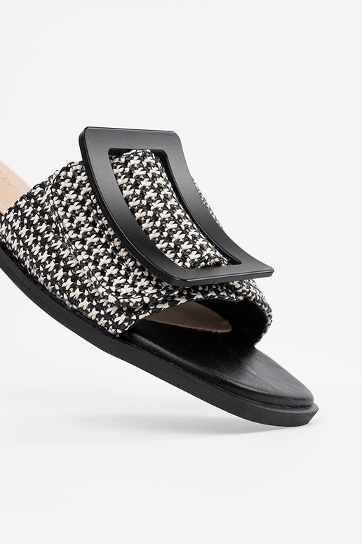 Schwarz-weiße flache Pantoletten