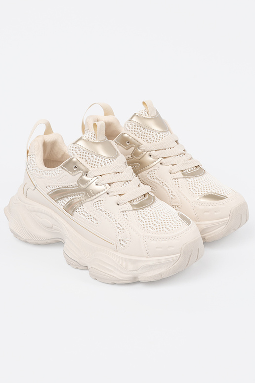 Elfenbeinfarbene Sportschuhe auf...