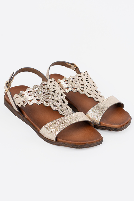 Elfenbeinfarbene Sandalen auf weißer... Elfenbeinfarbene Sandalen auf weißer...