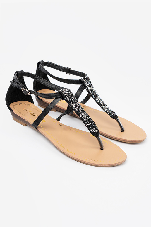 Flache schwarze Sandalen im... Flache schwarze Sandalen im...