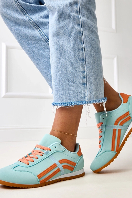Blaue Sneakers mit orangefarbenem... Blaue Sneakers mit orangefarbenem...