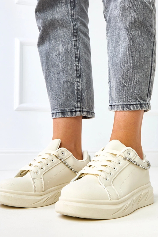 Sandfarbene Sneakers auf Plattform...