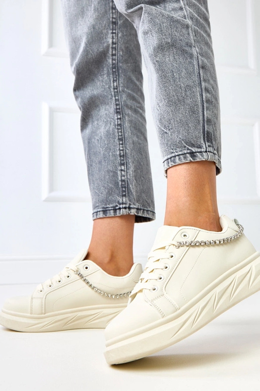 Sandfarbene Sneakers auf Plattform...