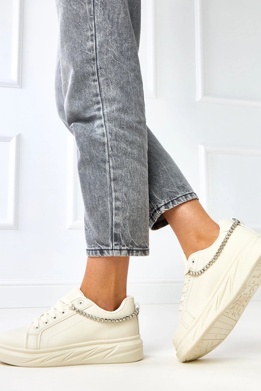 Sandfarbene Sneakers auf Plattform...