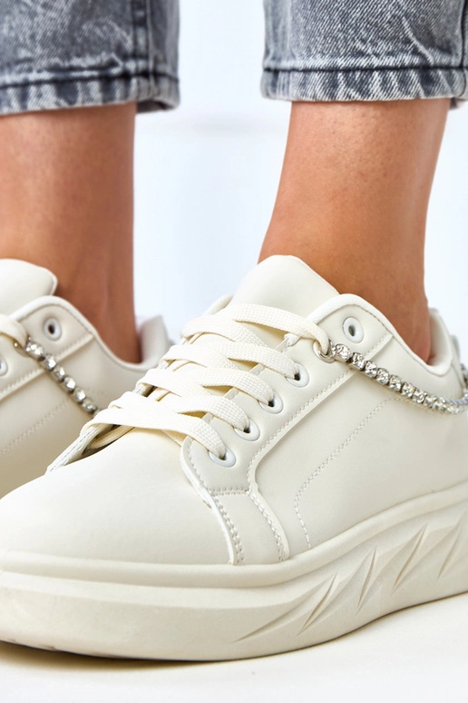 Sandfarbene Sneakers auf Plattform...