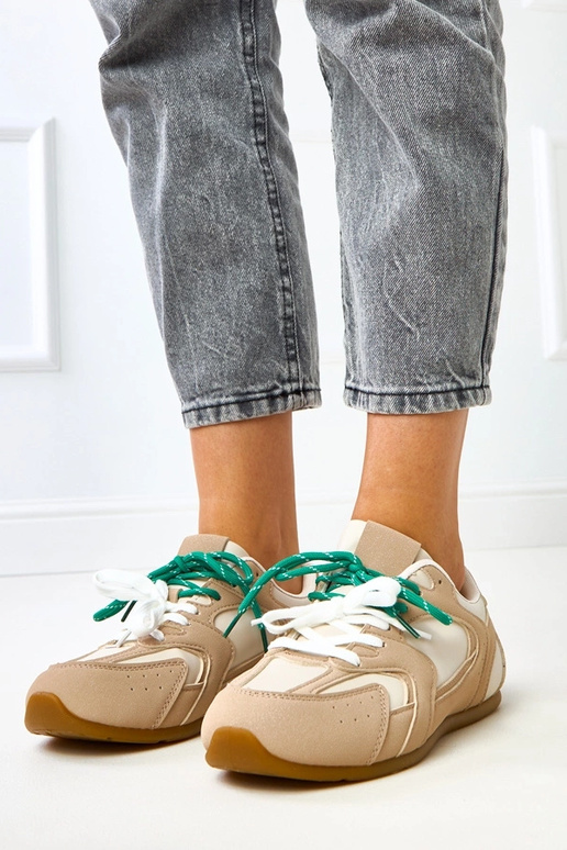 Beige Sportschuhe mit doppelten... Beige Sportschuhe mit doppelten...