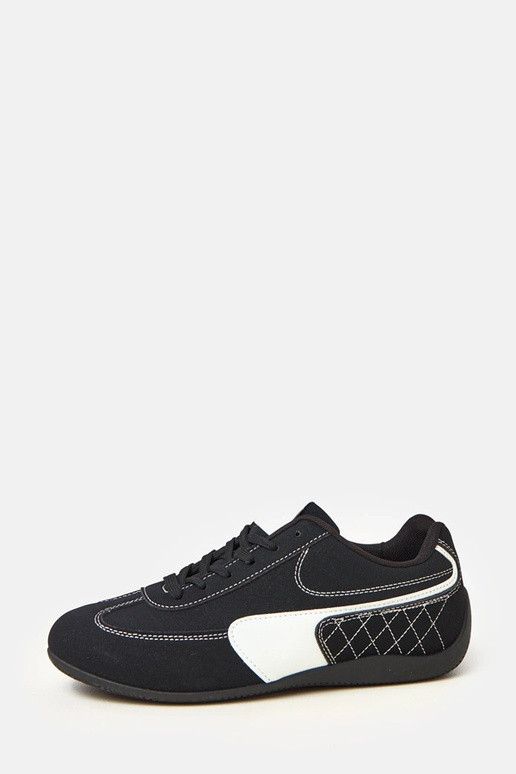 Schwarze Sportschuhe mit weißem...