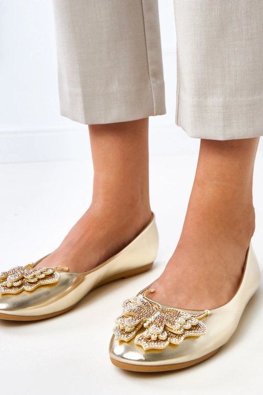 Goldene Ballerinas mit dekorativem...