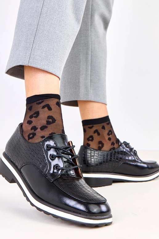 Schwarze Halbschuhe mit Prägung und...