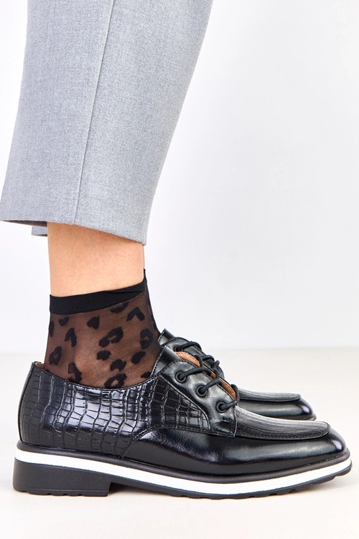 Schwarze Halbschuhe mit Prägung und...