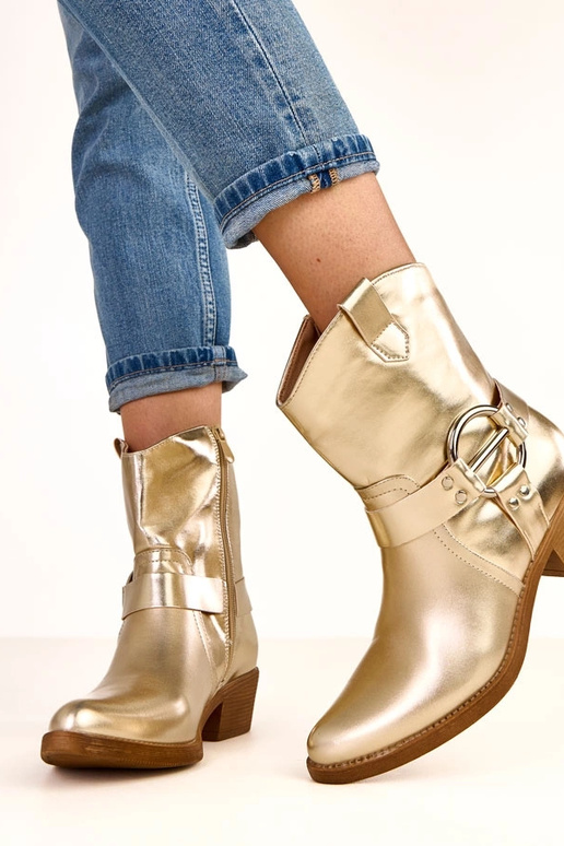 Goldene Cowboystiefel mit Absatz und... Goldene Cowboystiefel mit Absatz und...