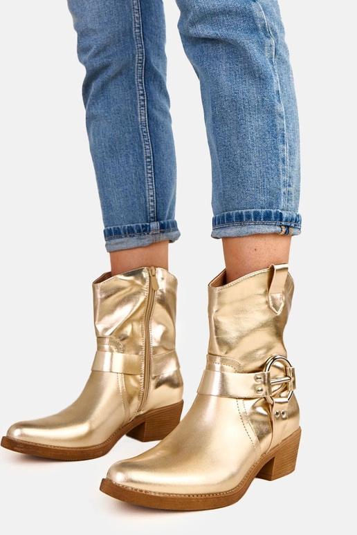 Goldene Cowboystiefel mit Absatz und... Goldene Cowboystiefel mit Absatz und...