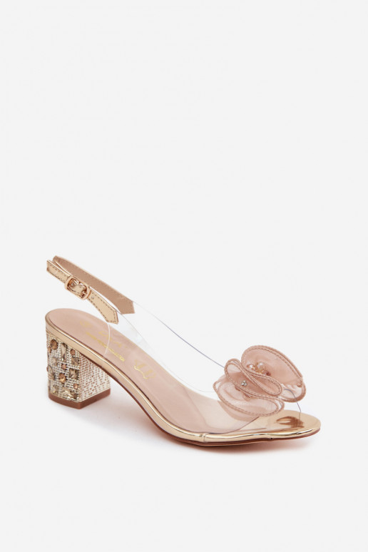 Transparente Sandalen mit Absatz und funkelnden Steinen in Gold