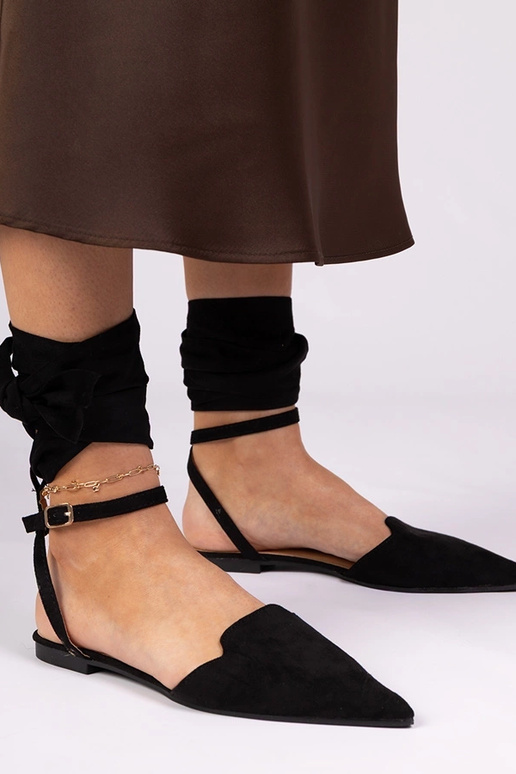 Schwarze Mules mit flachem Absatz Mella