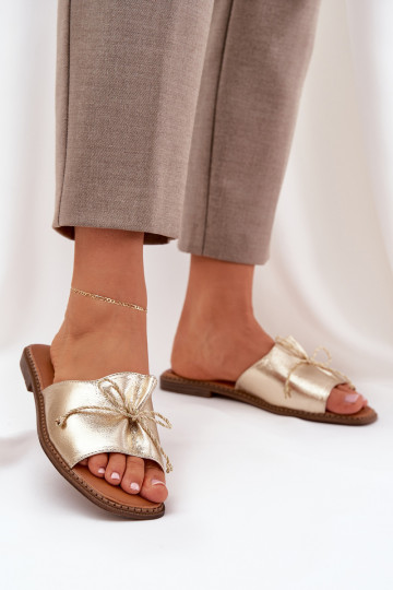 Goldene flache Slipper mit dekorativem Bogen Deonelis