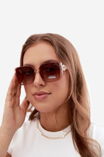 Sonnenbrille mit dekorativen Details in Rosa