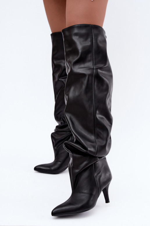 kniehohe Stiefeletten zum Hineinschlüpfen mit Absatz in schwarz Calmy