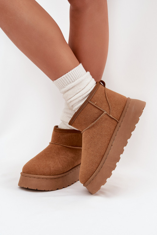 Sandfarbene Schuhe mit schwarzen Akzenten und dicker Sohle
