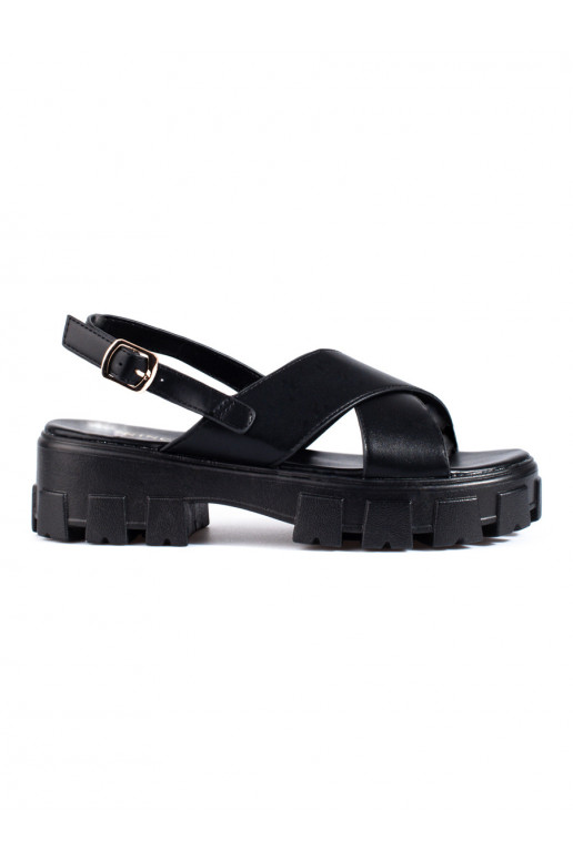 Schwarze Sandalen mit massivem... Schwarze Sandalen mit massivem...