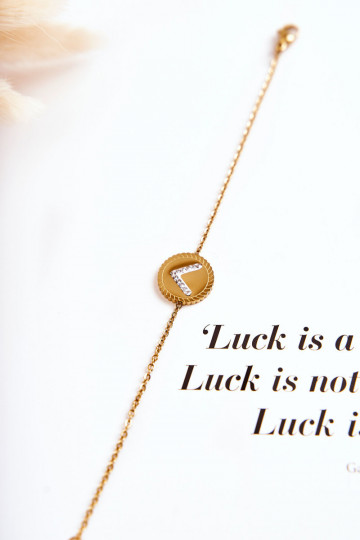 Damenarmband mit Ornamenten und Zirkonaugen in Goldfarbe